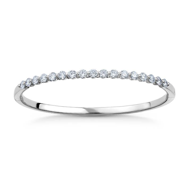 Elegant 18K white gold bangle featuring 17 round brilliant diamonds totaling approximately 1.19ctw, set in a shared prong technique for a contemporary and airy design, creating a dazzling effect.