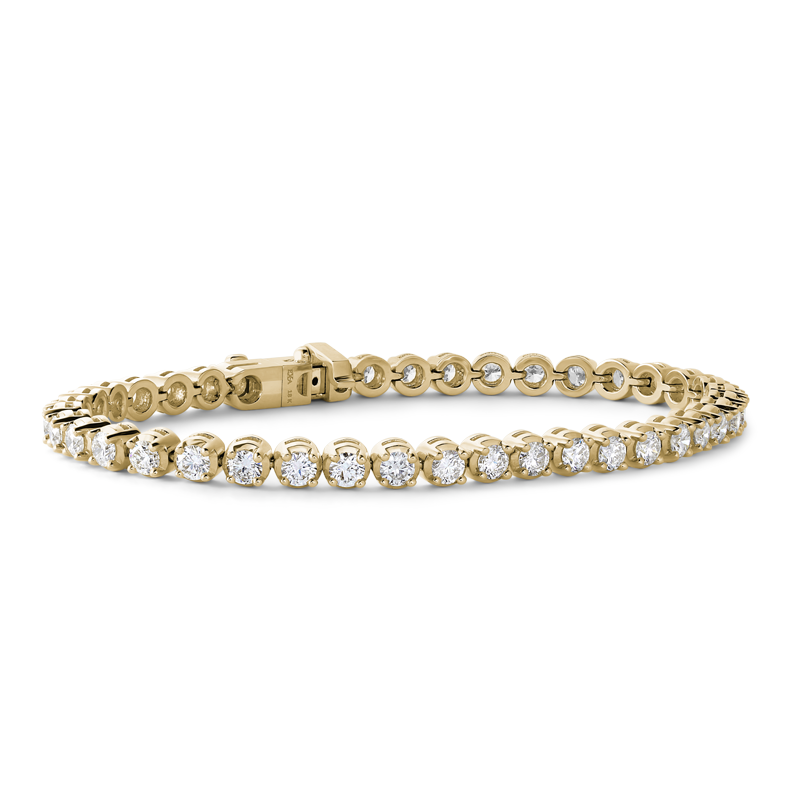 Stunning 18K yellow gold bracelet shimmering with 4.40tcw diamonds in a four-prong setting, featuring geometric patterns for brilliance and comfort, secured with a box clasp and slip-lever lock.