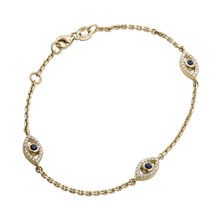 Charger l&#39;image dans la galerie, Intricate bracelet in 14K yellow gold, showcasing three evil eye motifs with 0.25tcw sapphires and 0.81tcw diamonds, on a 7&quot; adjustable cable chain, embodying protection and good luck symbols.

