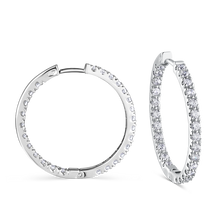 Load image into Gallery viewer, Hoops in 18K white gold, handcrafted by Ex Aurum in Montreal, featuring 52 round brilliant diamonds totaling approximately 1.82tcw, set both inside and out on 25mm hinged hoops for a captivating visual impact.
