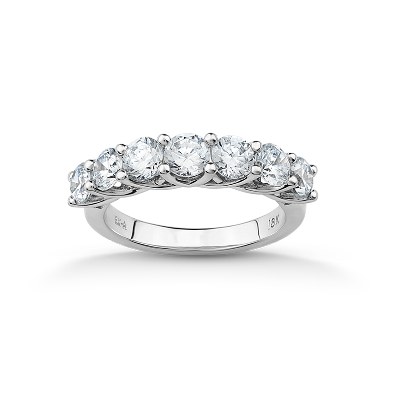 Sophisticated 18K white gold ring featuring seven round brilliant diamonds totaling an estimated 1.24tcw, set in a unique 'U' shaped gallery, embodying a blend of elegance and modern style.