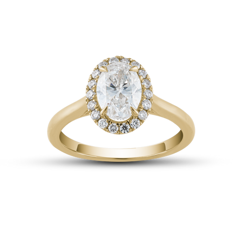 Elegant 18K yellow gold ring featuring a 1.02ct round brilliant diamond with a pavé halo and a cathedral shoulder design, offering a glowing and dimensional appearance, complemented by 0.18tcw of smaller pavé set diamonds.