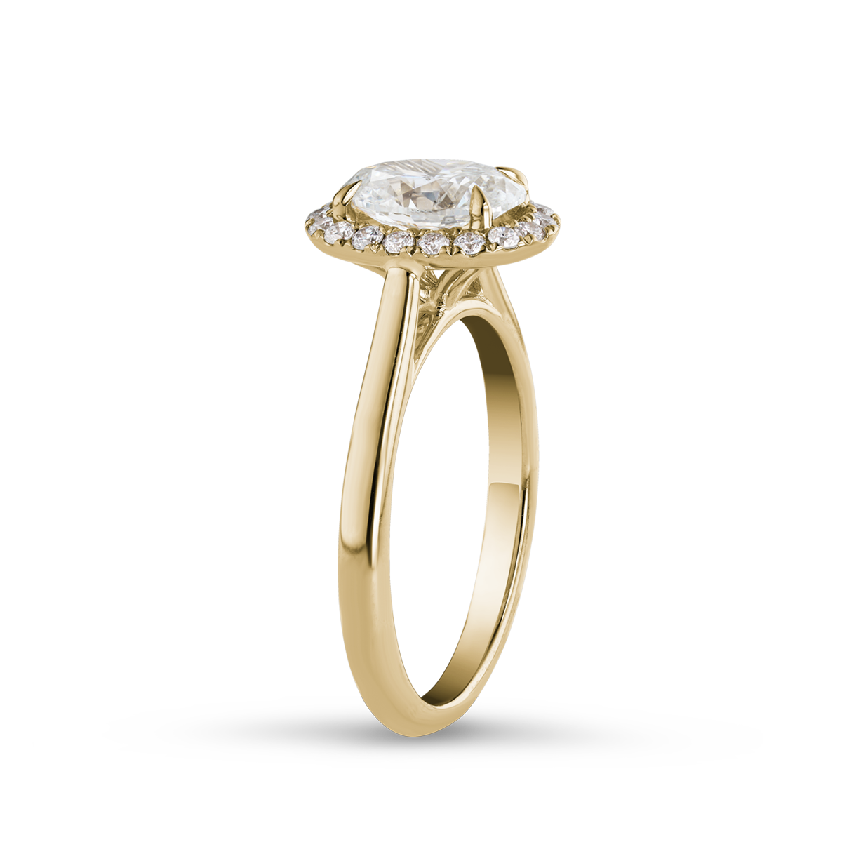 Elegant 18K yellow gold ring featuring a 1.02ct round brilliant diamond with a pavé halo and a cathedral shoulder design, offering a glowing and dimensional appearance, complemented by 0.18tcw of smaller pavé set diamonds.