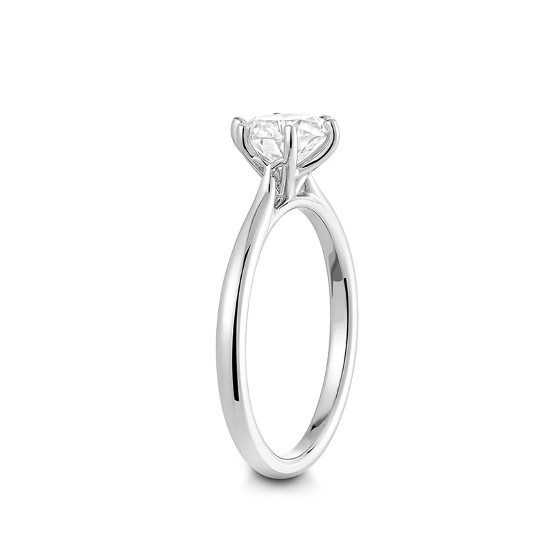 Elegant 18K white gold solitaire engagement ring featuring a 1ct round brilliant diamond in a six-claw setting, symbolizing harmony and stability, handcrafted by Ex Aurum in Montreal.