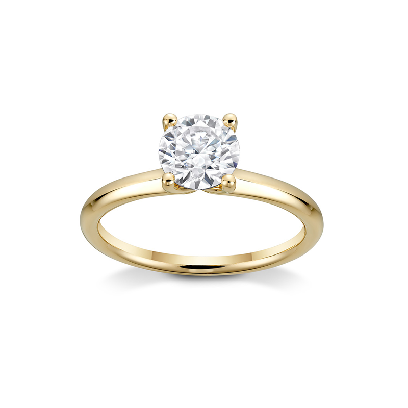 Elegant 14K yellow gold engagement ring, featuring a 1ct round brilliant diamond in a four-claw setting, with a gracefully tapering band, evoking the image of a delicately clasped bouquet, handcrafted in Montreal.