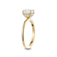 Load image into Gallery viewer, Charming engagement ring in 18K yellow gold, featuring a 1.5ct round brilliant diamond in an eagle claw setting, accented with a hidden halo of small diamonds.
