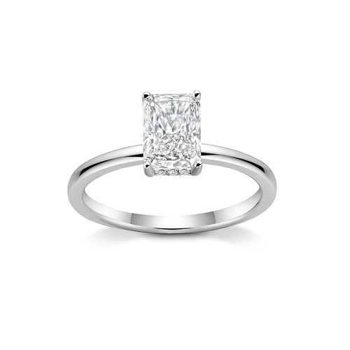 Stunning engagement ring in 18K white gold, featuring a 2ct radiant cut diamond, held high above a slim 1.8mm band with a hidden halo of small pavé diamonds.