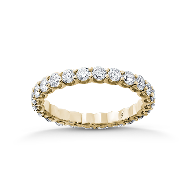 Exquisite full eternity ring in 18K yellow gold, featuring 1.44tcw of round brilliant diamonds, each 0.06ct, set in a unique scalloped gallery style with shared claw settings, blending tradition with modern design.