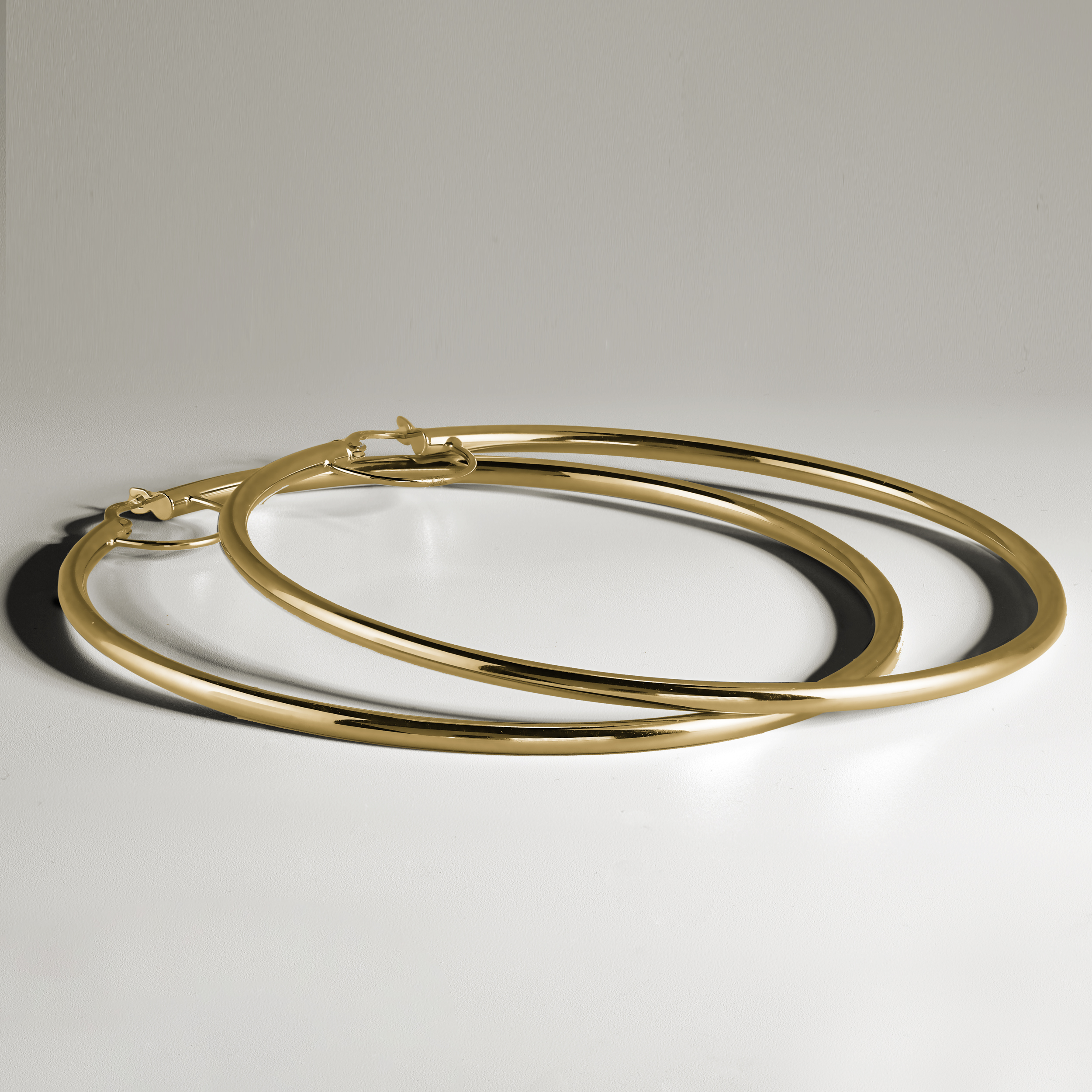 18K yellow gold hoop earrings, measuring approximately 72mm in diameter with a 2.5mm tube, designed for all-day comfort and a strong shape, crafted with Italian elegance.