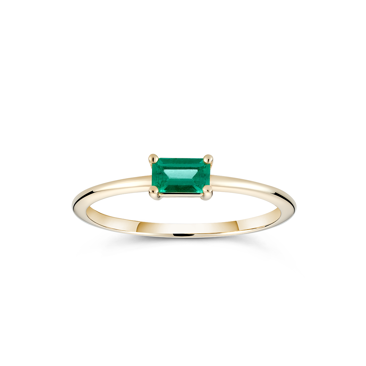 Elegant 'Emerald Burst' ring in 14K yellow gold, featuring a 0.25ct baguette-cut emerald in a low and long claw setting, slim and vibrant, ideal for unique stacking arrangements.