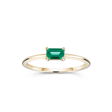 Load image into Gallery viewer, Elegant &#39;Emerald Burst&#39; ring in 14K yellow gold, featuring a 0.25ct baguette-cut emerald in a low and long claw setting, slim and vibrant, ideal for unique stacking arrangements.
