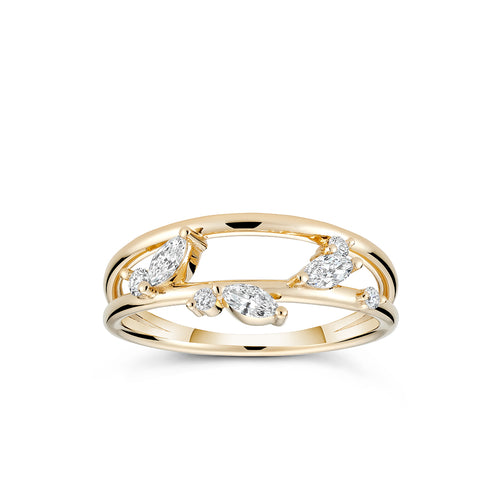 The ring, reminiscent of a garden trellis, features leaf-shaped diamond marquises set in 18K yellow gold. It's designed to fit low and taper, leaving space for additional rings. 