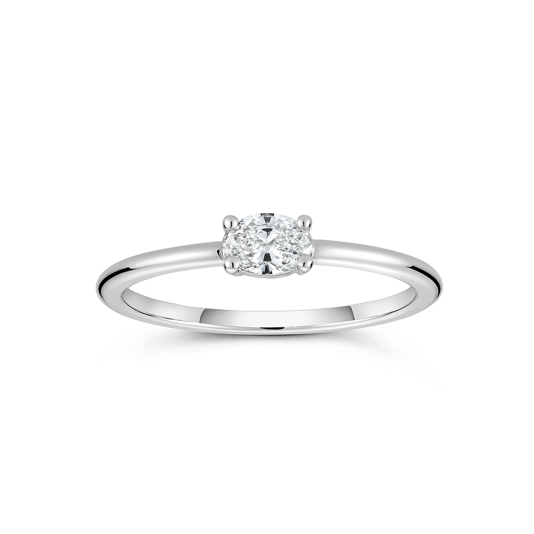 Elegant diamond ring in 14K white gold, featuring a 0.20ct single oval diamond on a slim band, embodying a promise of self-honor and handcrafted excellence from Ex Aurum in Montreal.