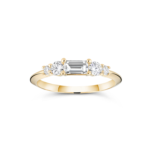 18K yellow gold engagement ring with a distinctive low knife-edged band, featuring a 0.31ct baguette cut diamond center, flanked by four round brilliant diamonds totaling 0.58tcw in prong settings, creating a scaffold-like structure.