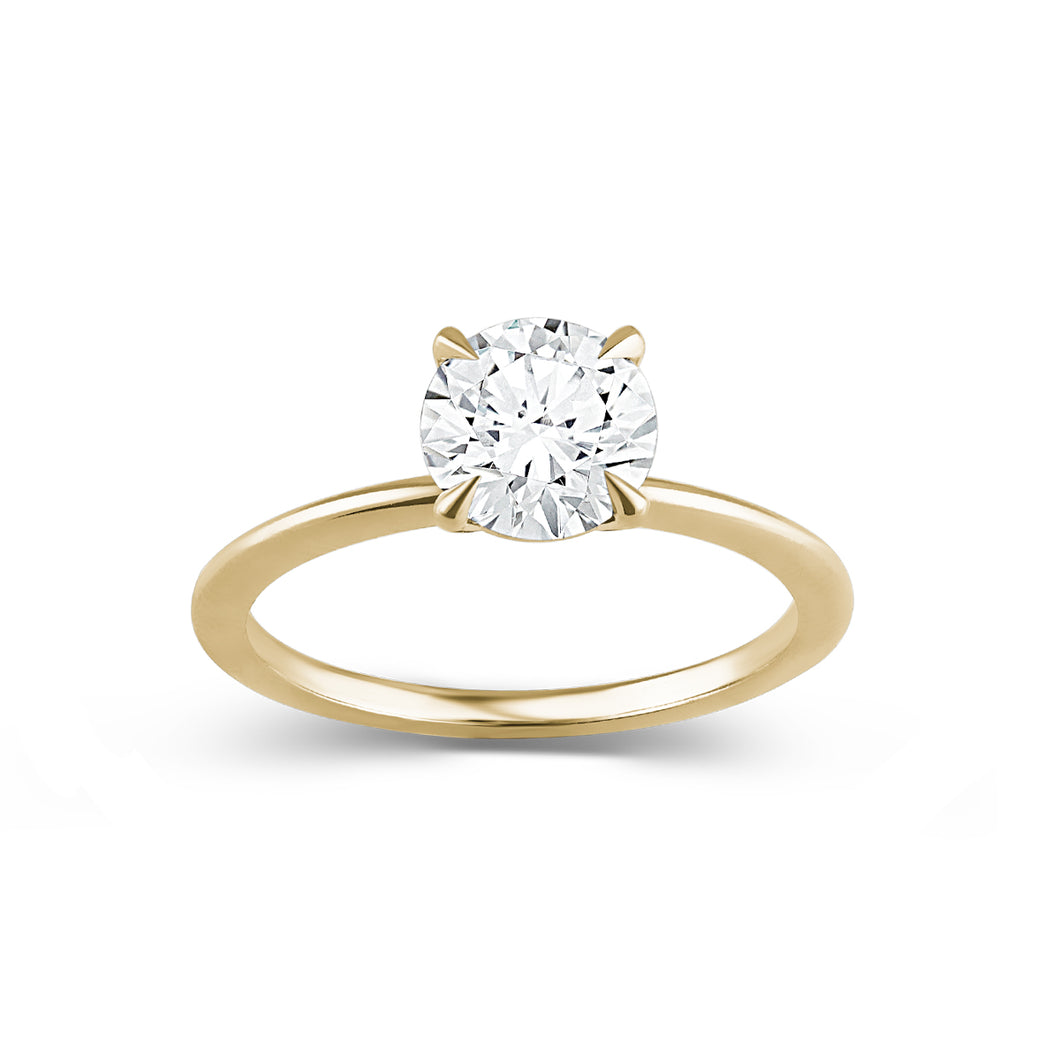 Delicate 'Fine Spirit' solitaire engagement ring in 14K yellow gold, featuring a 1.01ct lab diamond on a slim 1.6mm band with a reverse taper and finely pointed claws, embodying minimalist elegance.
