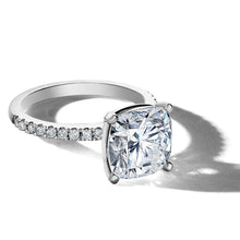 Load image into Gallery viewer, Exquisite engagement ring in 18K white gold, featuring a 3.18ct cushion cut diamond in a four-claw setting, complemented by 0.23tcw of small pavé set diamonds on the band, crafted to harmonize with various band styles.

