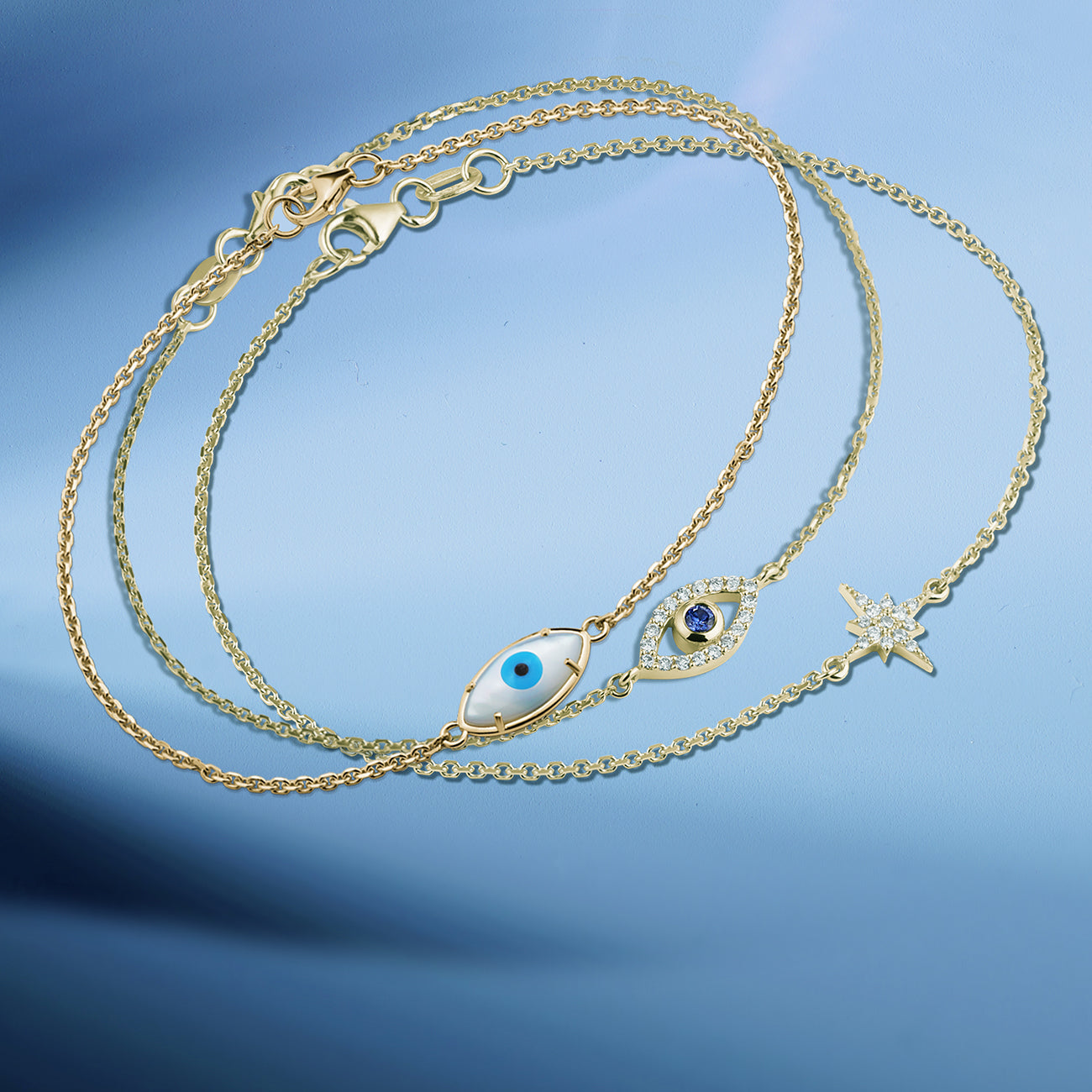 Double Eye bracelet featured stacked with other elegant bracelets.