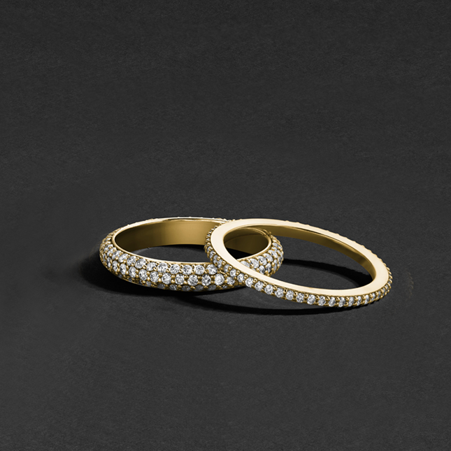 Dainty ring in 18K yellow gold, featuring a full eternity design with 0.28tcw diamonds in fine pavé, perfect as a standalone piece or complementing other jewelry with its subtle sparkle.